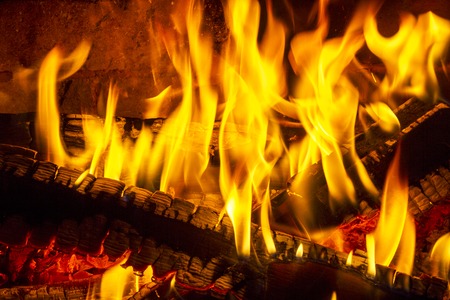 Log fire in a fireplace. Burning and glowing pieces of wood in Fireplace.の写真素材