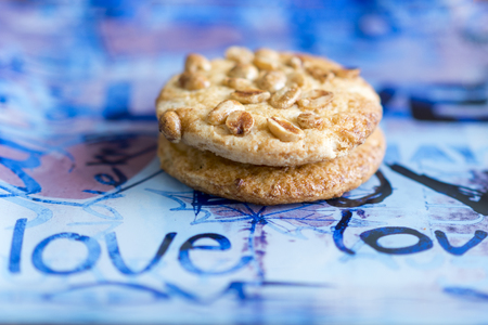 Cookies with peanuts on a blue plate. Cookies close-upの写真素材