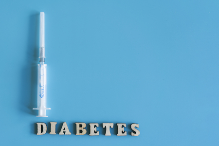 Diabetes inscription on a blue background. copy space.の写真素材