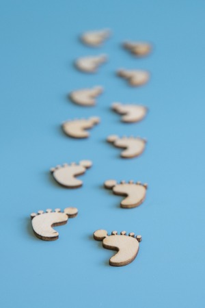 Footprints on a blue background. vertical photo.の写真素材