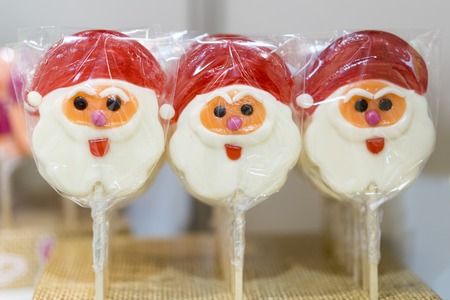 Lollipops in the form of Santa Claus. The approach of the holiday of the new year and Christmas.