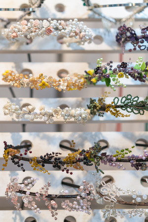 Headband with precious stones on the stand in the store.Fine jewelry on the head for women. vertical photo.の写真素材