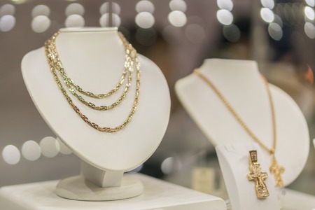 Gold necklace on the showcase.