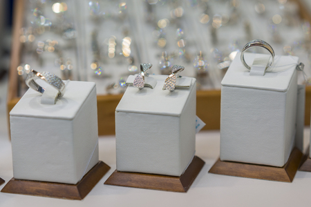 Diamond engagement rings in a jeweler shop display. selected focusの写真素材