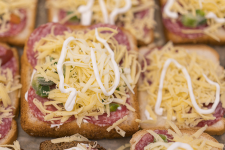 Cheese sandwiches before cooking in the ovenの写真素材