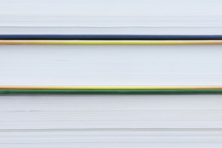 Stack of books background. many books piles. Many Books Piles. Books with color covers. Back to schoolの写真素材