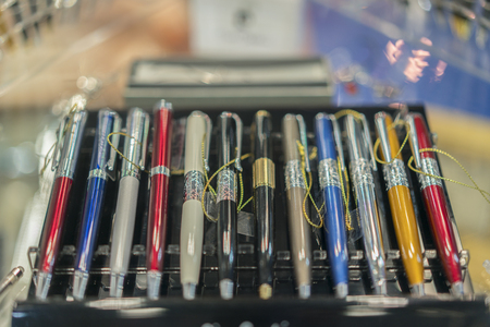 Beautiful handles in the case. Multicolored gift pens. blurry.の写真素材