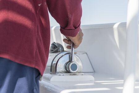A man drives a yacht. close-up.の写真素材