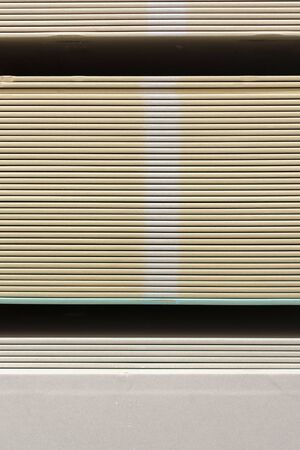 The stack of gypsum board preparing for construction. Gypsum plasterboard in the pack. vertical photo.の写真素材