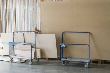 Trolley in a hardware store with building materials. Warehouse large storage or logistic or cargo for distribution.の写真素材