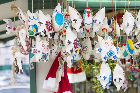 Christmas market fair kiosk with handcrafted wooden christmas decorations. Close up of Christmas...