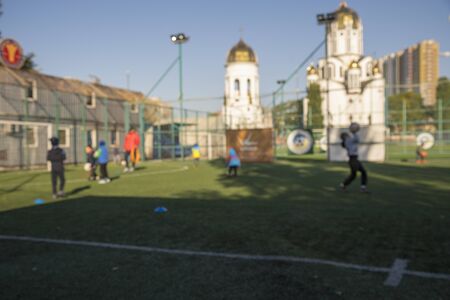 Boys at a football training. The concept of a healthy lifestyle and sport. Blurry.の写真素材