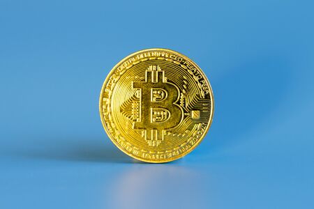 Bitcoin coin on a blue background.の写真素材