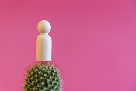 The human figure on needles on a pink background. Leg pain concept. copy space.の写真素材