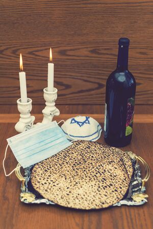 Jewish holiday Passover banner design with wine, matzo and. Kipa and protective medical mask....