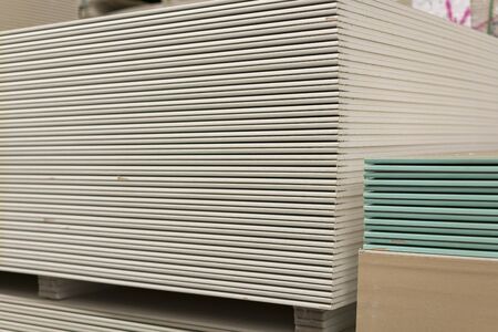 Drywall in a hardware store. Drywall sheets for repair and construction. Repair and construction concept.の写真素材