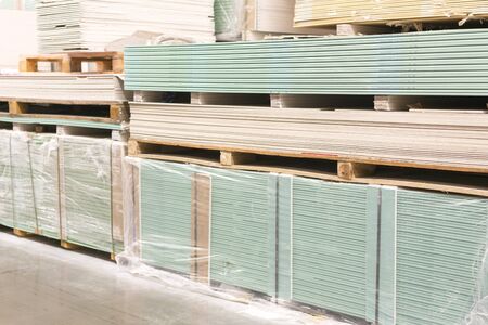 Drywall in a hardware store. Drywall sheets for repair and construction. Repair and construction concept.の写真素材
