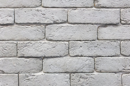 Seamless texture of white decorative stacked stone, natural stone cladding. brick background. close up. Backgroundの写真素材