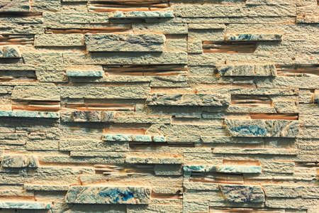 Stacked stone wall, natural stone cladding. Stone wall for background,Slab stone wall texture. Wall...