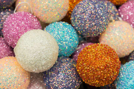 Pile of glass, christmas ornaments in various colors. Colorful Christmas balls, Closeup. Decorations for the holiday. Multicolored balls. Christmas decorations. New Year. Christmas.の写真素材