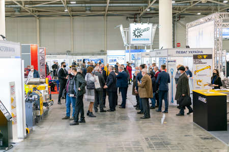 Kiev, Ukraine November 25 2020. Industrial Exhibition during a pandemic. People wearing medical masks during a pandemic. Exhibition and social distanceのeditorial素材
