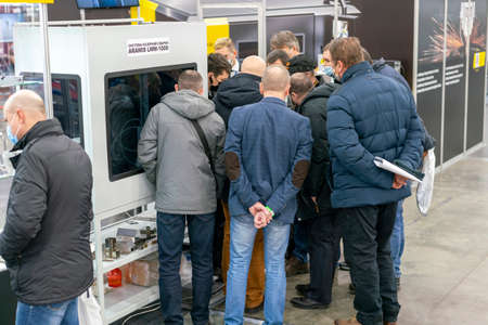 Kiev, Ukraine November 25 2020. Industrial Exhibition during a pandemic. People wearing medical masks during a pandemic. Exhibition and social distanceのeditorial素材