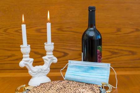 Dust mask, bottle of wine and matzah - a traditional Jewish food for Passover.の写真素材