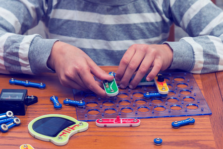 Cropped shot of a girl building a robot details close up education science technology robotics...
