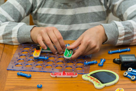Cropped shot of a girl building a robot details close up education science technology robotics futuristic electronic mechanic developing creativity constructor playing toys conceptの写真素材