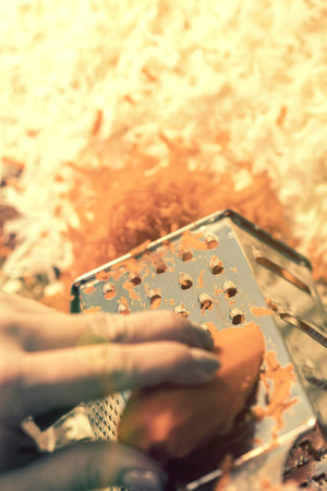 Woman rubbing carrots. Sauerkraut with carrots. Pickled cabbage. Sauerkraut cooking process. toned.