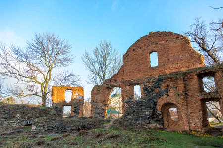 Ruined fortress against the blue sky. The ruins of an ancient fortress watchtower against the blue skyの写真素材