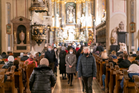 People during a sermon in a Catholic church. toned. selected focus.のeditorial素材