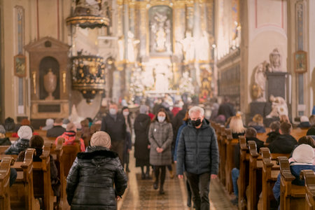 People during a sermon in a Catholic church. toned. selected focus.のeditorial素材