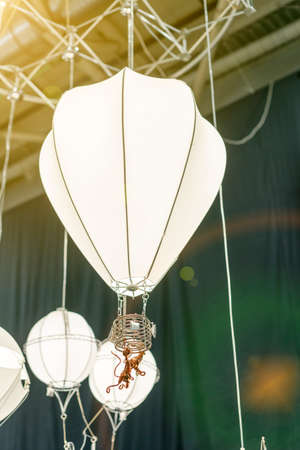 Creative chandelier for childrens room. Lamp in the form of a balloon for a childrens room. tonedの写真素材