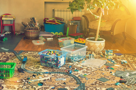 Games floor for preschoolers kindergarten. interior childrens room. mess in the room. mess in the childrens room, scattered toys, boxes on the floor. tonedの写真素材