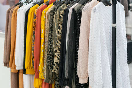 spring and summer womens clothing in the store. bright, modern clothes in a boutique. Womens hip...