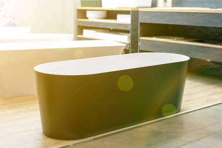 Black bathtub at a hardware store. Sanitary engineering shop. tonedの写真素材
