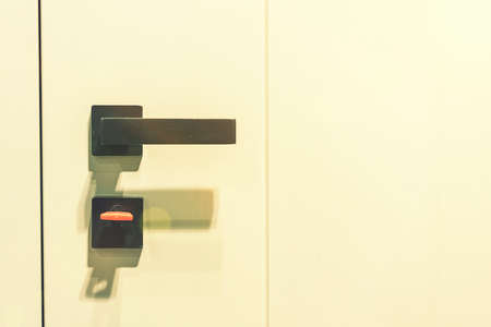Keys stuck in a lock. closeup Door lock keys, Real estate concept door handle, Key insert and hold in metallic knob on white door horizontal. tonedの写真素材