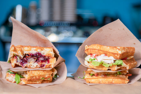 Sandwich in a paper bag close-up. Sandwich filet americain, close up of burger. Fast, but unhealthy foodの写真素材