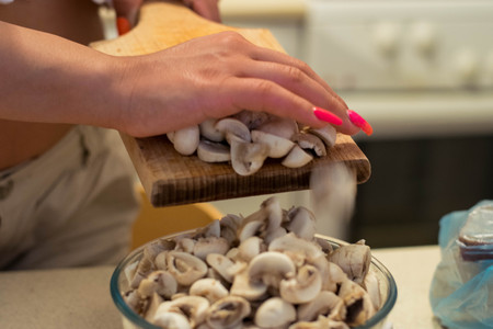 Young woman cooking in the kitchenの写真素材