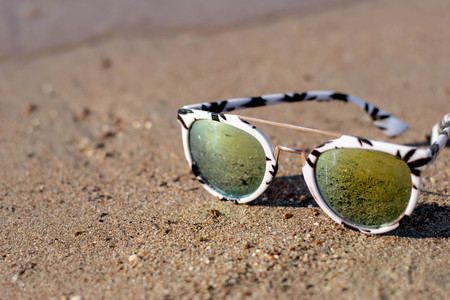 Sunglasses on the beachの写真素材