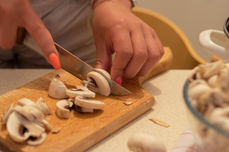 Young woman cooking in the kitchenの写真素材