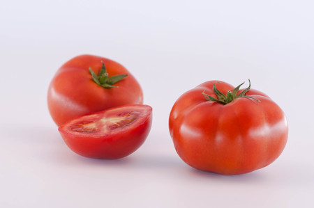 Red Tomatoes and slicesの写真素材