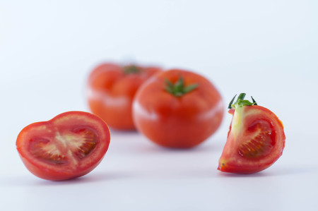 Red Tomatoes and slicesの写真素材