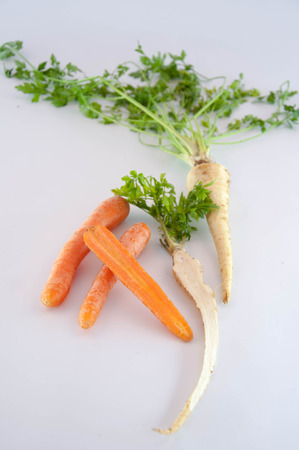 Root vegetables. Carrots and parsleyの写真素材