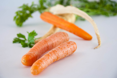 Root vegetables. Carrots and parsleyの写真素材