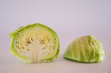 Green cabbage isolated on white backgroundの写真素材