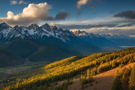 Mountain autumn landscape with colorful forest and snow-capped peaksの写真素材