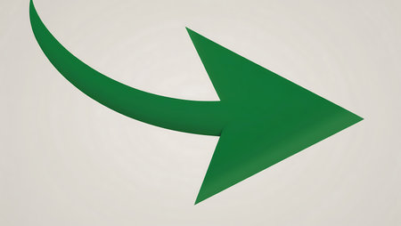 A green arrow curves smoothly to the right, standing out against a light background. The design emphasizes direction and guidance, ideal for navigation or signage purposes.の写真素材