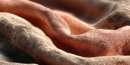 Delicate fabrics intricately woven intermingle in the soft glow casting a gentle artistic allure.